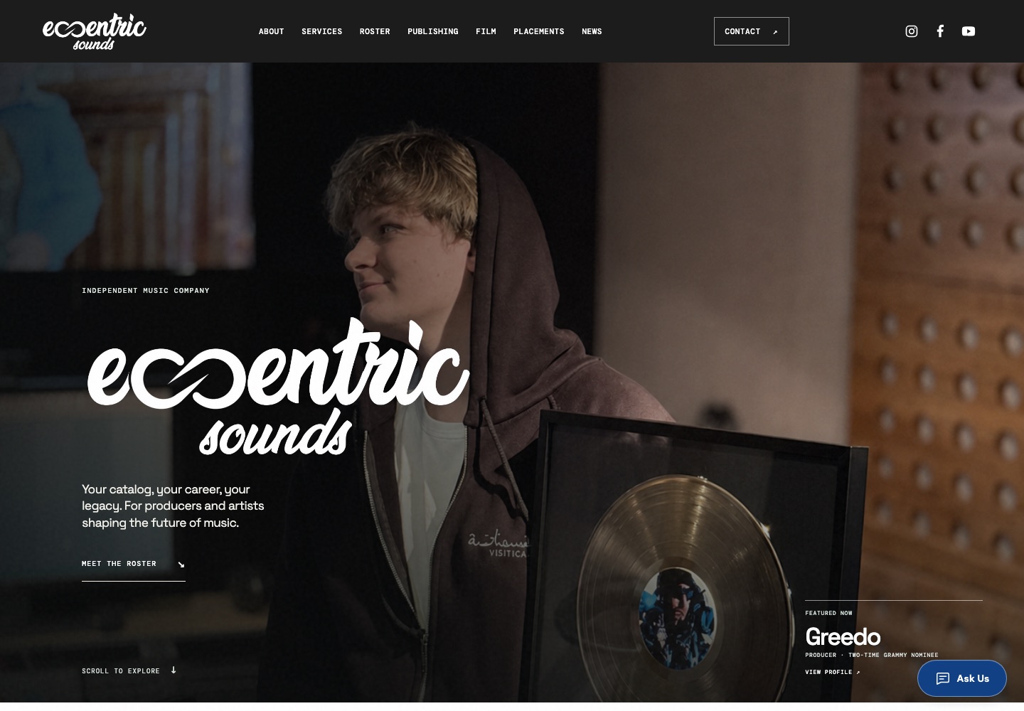 Eccentric Sounds website hero featuring a producer holding a framed record